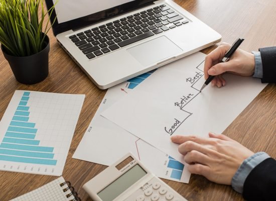 high-angle-businessman-with-laptop-office