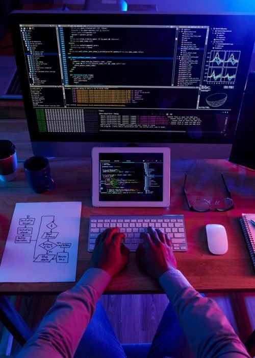 top-view-unrecognizable-hacker-performing-cyberattack-night Custom-Coded Website Development